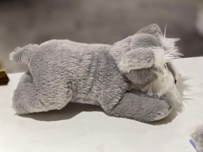 Dvärgschnauzer / schnauzer mjukisdjur liggande SEMO